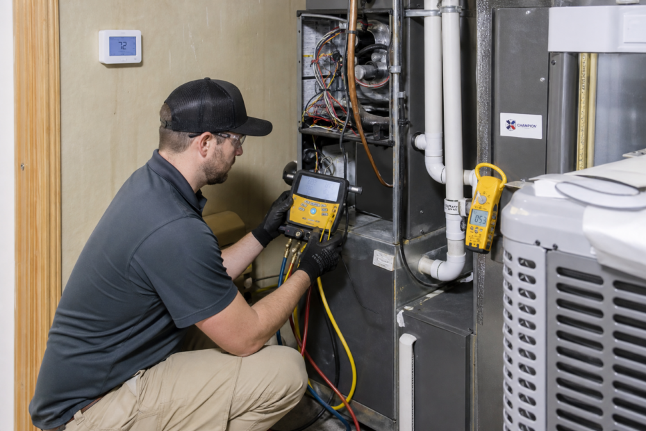 HVAC technician performing startup and commissioning checks on a newly installed residential system